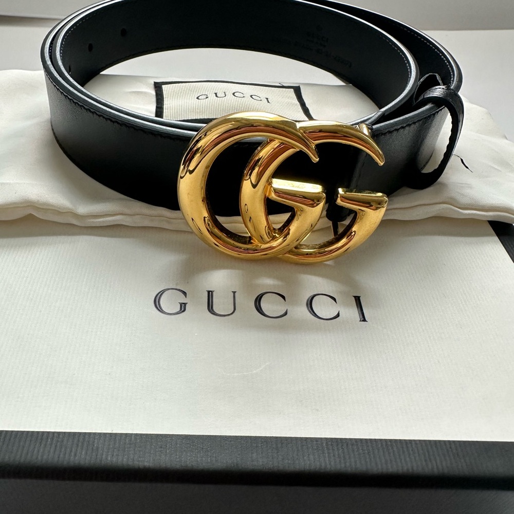Gucci Black and Gold Belt with Iconic GG Buckle